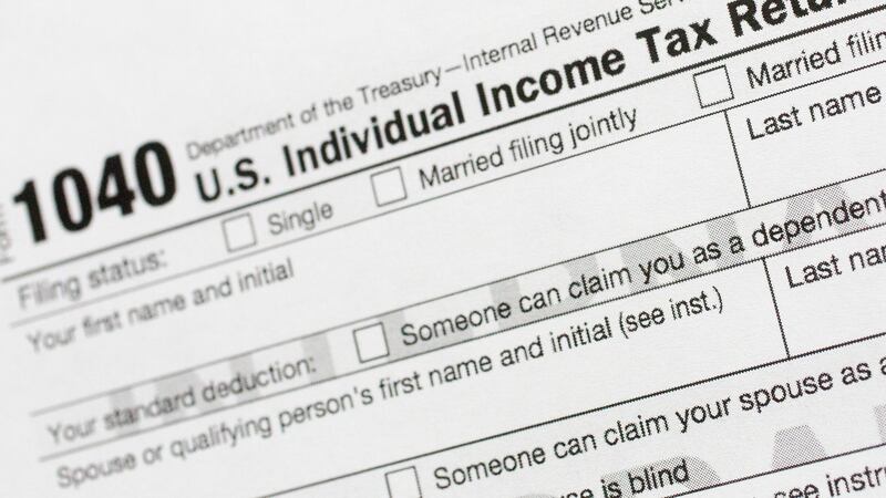 FILE - This July 24, 2018, file photo shows a portion of the 1040 U.S. Individual Income Tax...