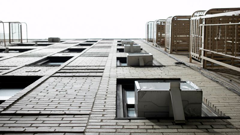 FILE - Window air conditioning units sit in windows in New York. In a major action to address...