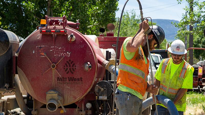 Mountain West Technologies workers place new fiber cables in residential areas of Casper.