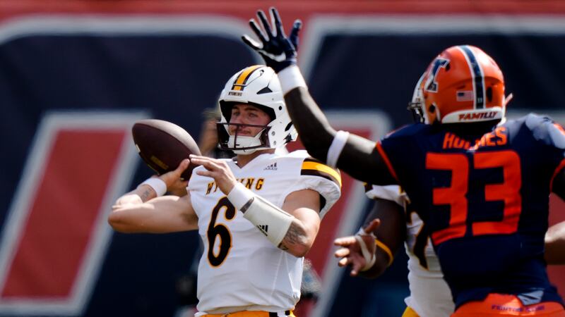 Aug 27, 2022; Champaign, IL, USA; Wyoming Cowboys quarterback Andrew Peasley (6) looks to...