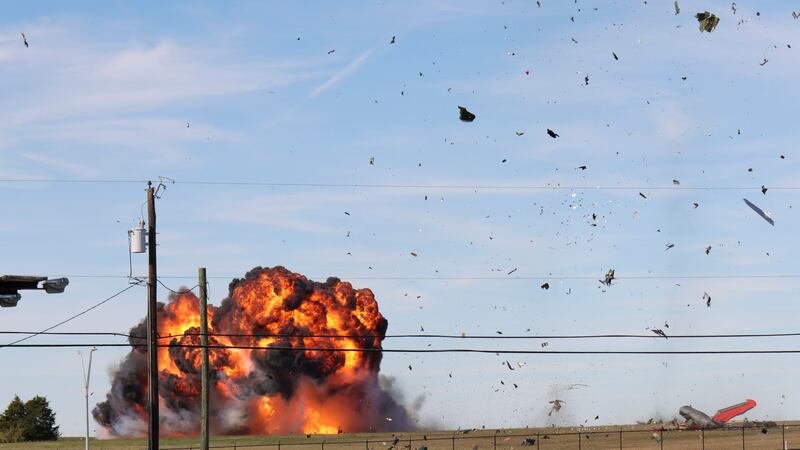 FILE - In this photo provided by Nathaniel Ross Photography, a historic military plane crashes...
